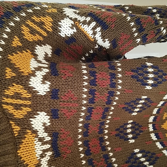 Geometric patterned sweater with a darj olive green backgound with earth tones. - Picture 2 of 3